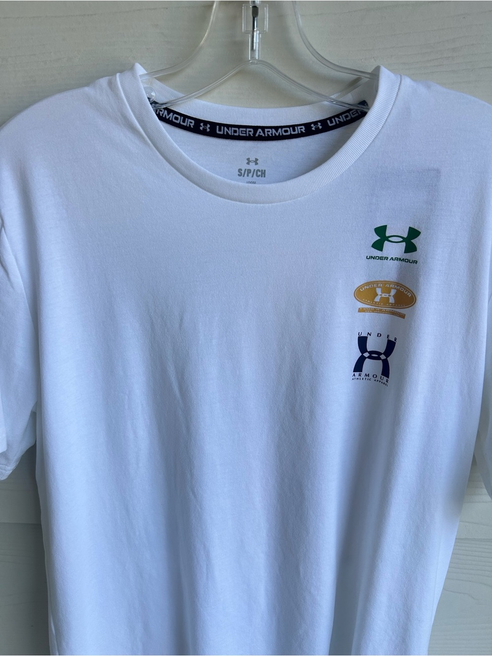 Under Armour White Short Sleeve Tee with Green, Gold and Navy Logo‎ Stack
